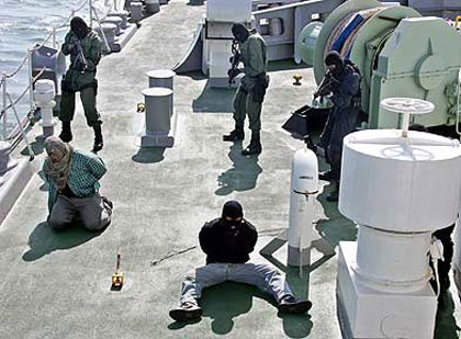 personnel from a Malaysian police amphibious unit conduct a joint anti-piracy training exercise with Japanese and Thai forces near the Bay of Bengal, Feb. 2, 2007