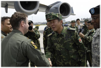 Senior Captain greets the first U.S. aircrews delivering earthquake relief supplies