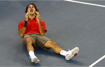 Roger Federer overcome with emotion after he defeated Andy Murray, 6-2, 7-5, 6-2, to win his 13th career Grand Slam title, one behind Pete Sampras’s record