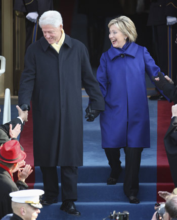 Secretary of State nominee Hillary Rodham Clinton and husband, the former President Bill Clinton, arrive at the Capitol in Washington