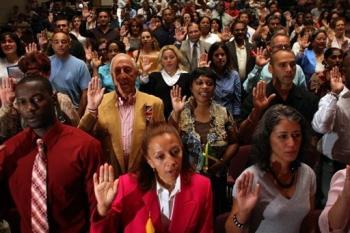 New US citizens are sworn in during a naturalization ceremony