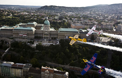 Hungarian pilot Peter Besenyei (bottom), Britain's Nigel Lamb and Paul Bonhomme (top) fly over Budapest, Hungary