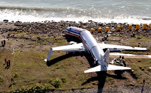 An aerial view of the cracked fuselage of American Airlines flight AA331, which crashed landed overnight on a flight from Miami to Jamaica, just beyond the runway of Norman Manley international airport in Kingston, Wednesday, Dec. 23, 2009. More than 40 people were injured, at least 4 seriously, and there were no fatalities, according to officials, after the plane overshot the runway when it landed in heavy rain.