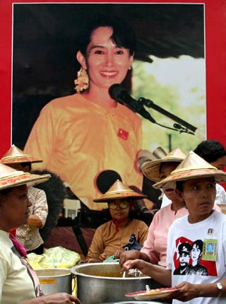 Yangon, Burma: supporters of Aung San Suu Kyi serve up food at celebrations to mark her birthday at the National League for Democracy party headquarters