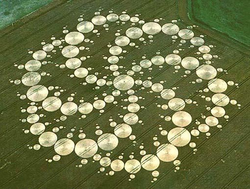 A 780 ft. crop circle in the form of a double (six-sided) triskelion composed of 409 circles. Location: Milk Hill, 2001.