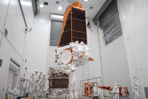 the spacecraft is guided onto the third stage of a Delta II rocket