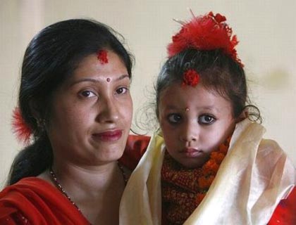 new kumari or living goddess, was carried from her parents' home to an ancient palatial temple in the heart of the Nepali capital, Katmandu, where she will live until she reaches puberty and loses her divine status