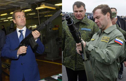 Russian President Dmitry Medvedev holds a Kalashnikov gun