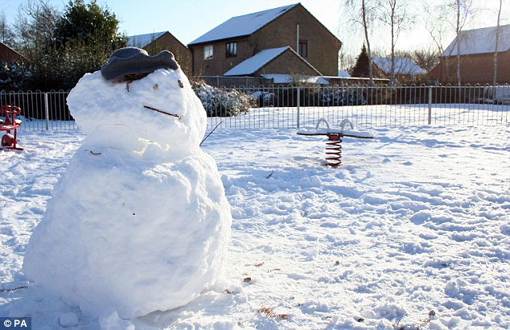 A snowman in Chapel Break, Norwich, UK this afternoon - Dec. 20, 2009. Many homes have been without power since Thursday night as a result of the runway of snow.