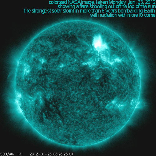 This colorized NASA image taken Jan. 23, 2012 from the Solar Dynamics Observatory, shows a flare shooting out of the top of the sun.